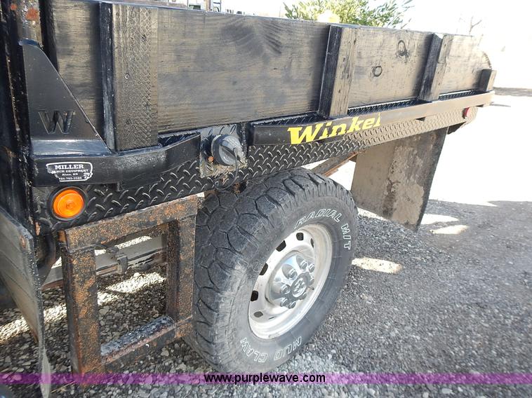 image for item L3583 2006 Dodge Ram 2500HD Quad Cab flatbed pickup truck