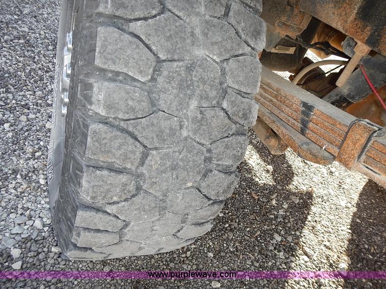 image for item L3583 2006 Dodge Ram 2500HD Quad Cab flatbed pickup truck