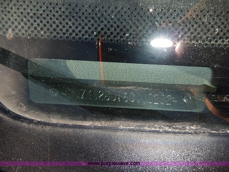 image for item L3583 2006 Dodge Ram 2500HD Quad Cab flatbed pickup truck