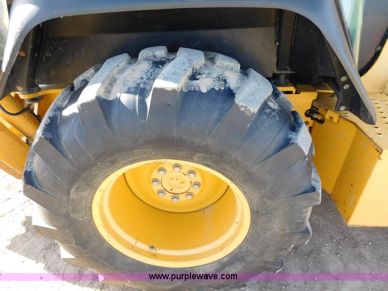 image for item AW9332 2000 John Deere 310SE backhoe