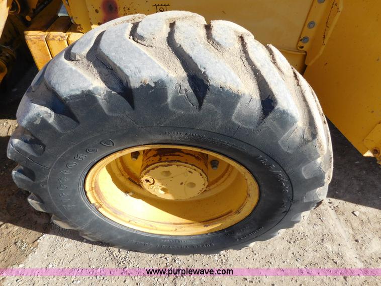 image for item AW9332 2000 John Deere 310SE backhoe