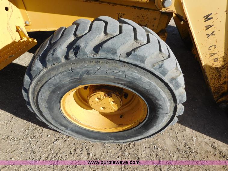 image for item AW9333 1997 John Deere 310SE backhoe