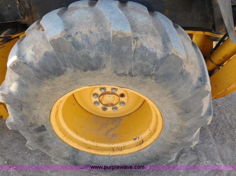 image for item AW9333 1997 John Deere 310SE backhoe