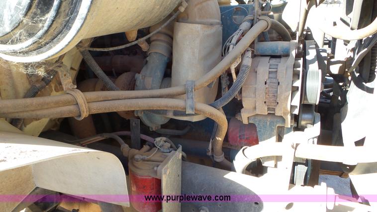 image for item J1335 1998 International 4700 flatbed truck