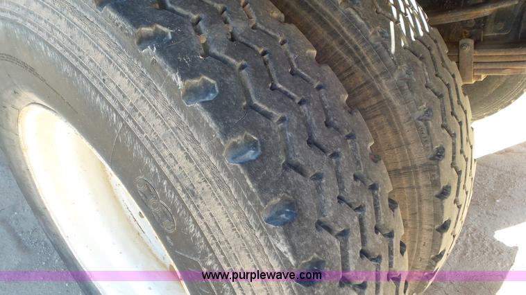 image for item J1335 1998 International 4700 flatbed truck