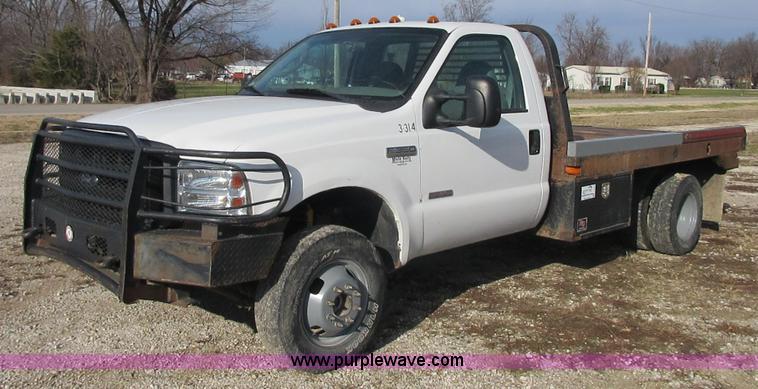 image for item I1818 2007 Ford F350 Super Duty XL flatbed pickup truck