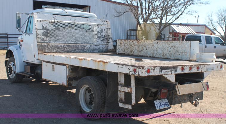 image for item J1313 2000 International 4700 flat bed truck