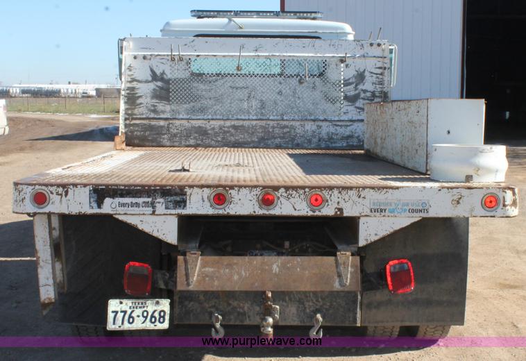 image for item J1313 2000 International 4700 flat bed truck