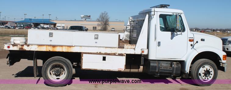 image for item J1313 2000 International 4700 flat bed truck