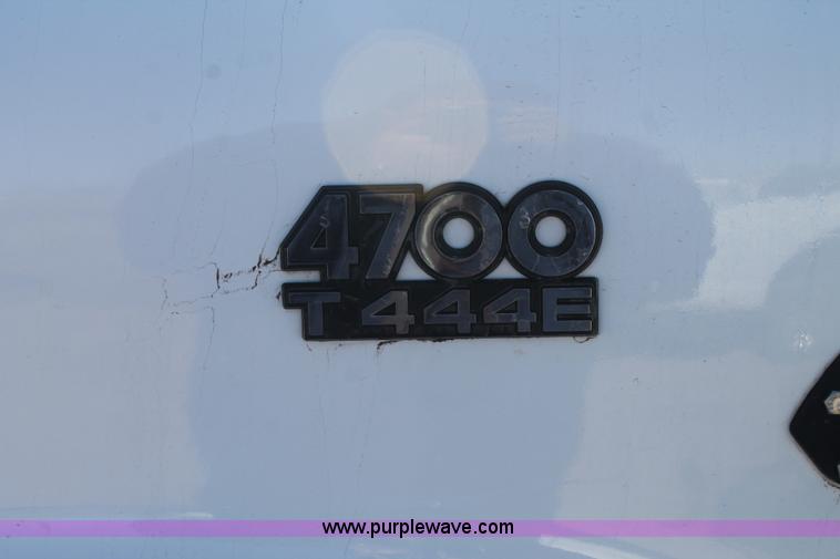 image for item J1313 2000 International 4700 flat bed truck