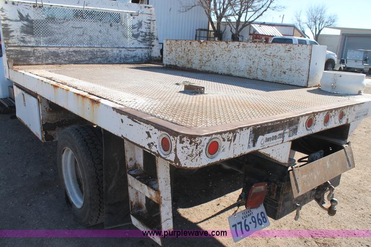 image for item J1313 2000 International 4700 flat bed truck