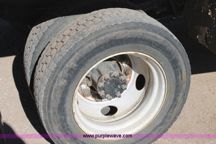 image for item J1313 2000 International 4700 flat bed truck