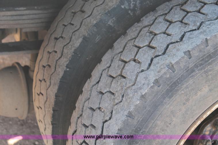 image for item J1313 2000 International 4700 flat bed truck