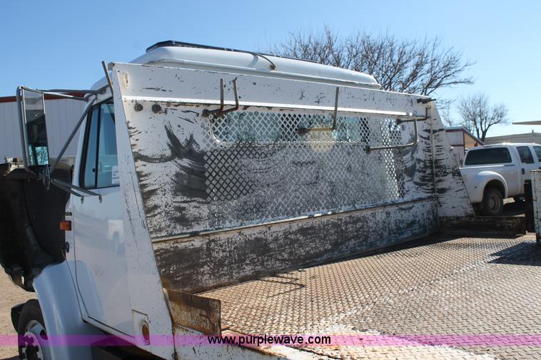 image for item J1313 2000 International 4700 flat bed truck