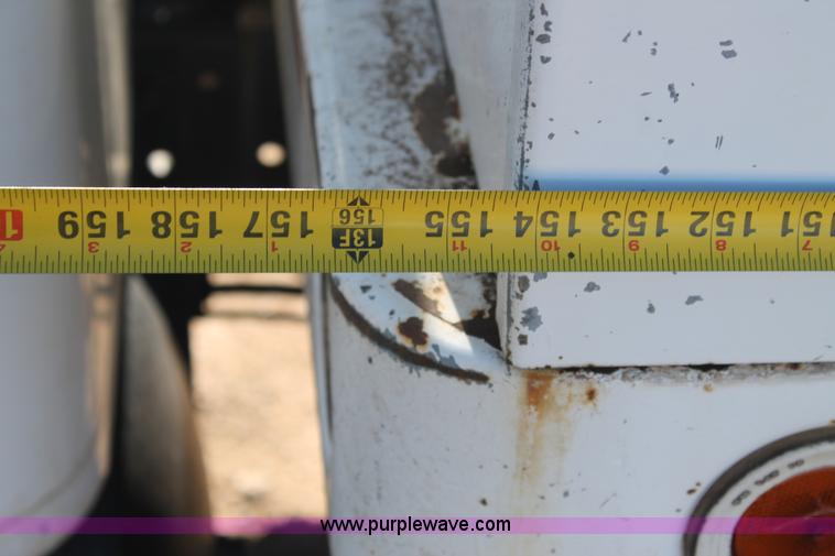 image for item J1313 2000 International 4700 flat bed truck