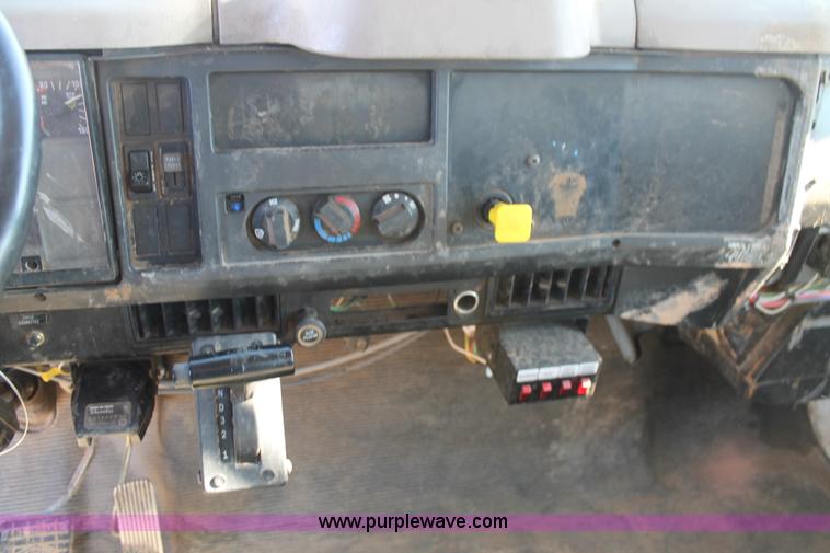 image for item J1313 2000 International 4700 flat bed truck