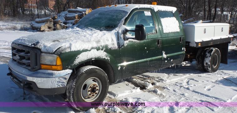 image for item J4640 1999 Ford F350 Super Duty XL Crew Cab flatbed pickup truck