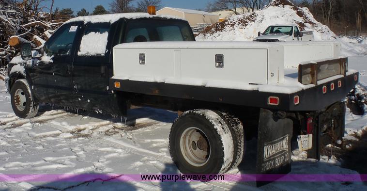 image for item J4640 1999 Ford F350 Super Duty XL Crew Cab flatbed pickup truck