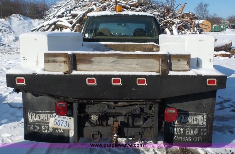 image for item J4640 1999 Ford F350 Super Duty XL Crew Cab flatbed pickup truck