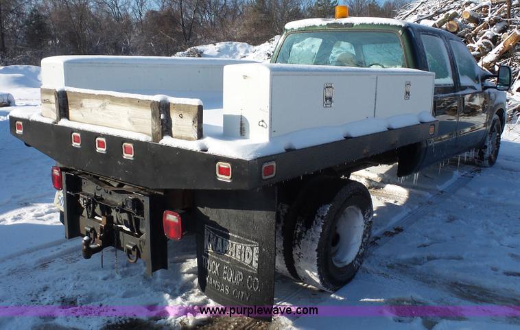 image for item J4640 1999 Ford F350 Super Duty XL Crew Cab flatbed pickup truck