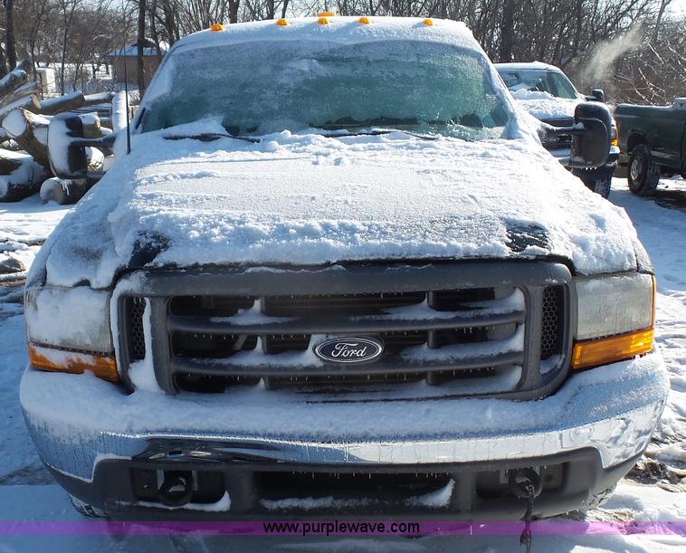 image for item J4640 1999 Ford F350 Super Duty XL Crew Cab flatbed pickup truck