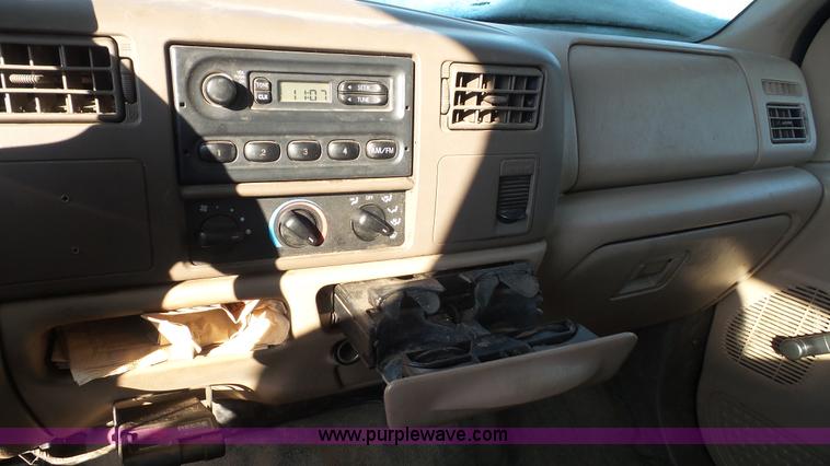 image for item J4640 1999 Ford F350 Super Duty XL Crew Cab flatbed pickup truck