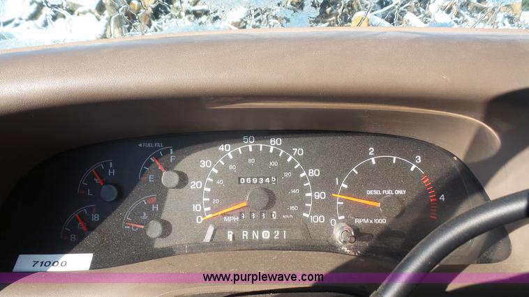 image for item J4640 1999 Ford F350 Super Duty XL Crew Cab flatbed pickup truck