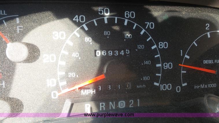 image for item J4640 1999 Ford F350 Super Duty XL Crew Cab flatbed pickup truck