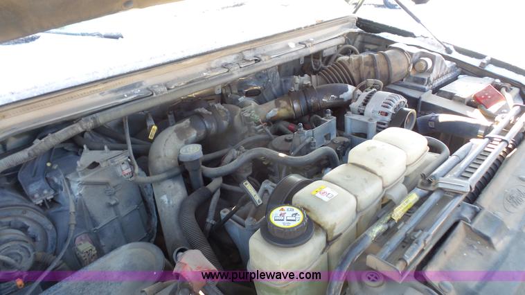 image for item J4640 1999 Ford F350 Super Duty XL Crew Cab flatbed pickup truck