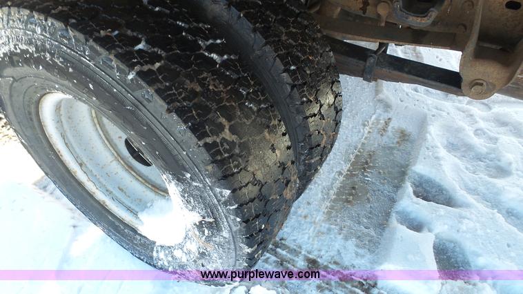 image for item J4640 1999 Ford F350 Super Duty XL Crew Cab flatbed pickup truck