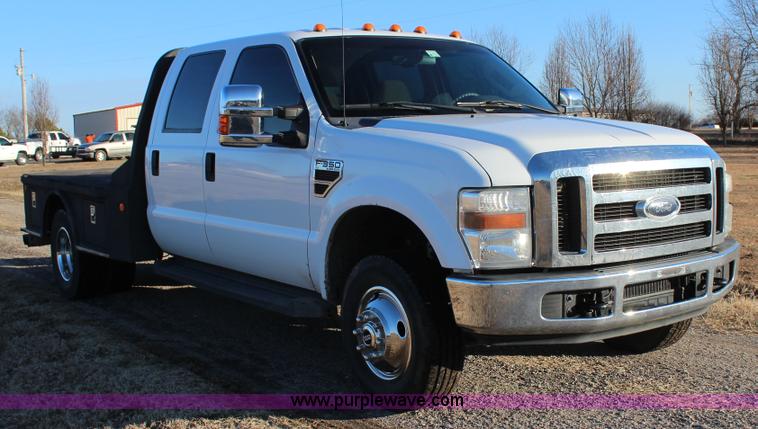 image for item J7642 2008 Ford F350 Super Duty XLT Crew Cab flatbed pickup truck