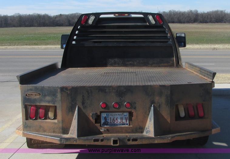 image for item J7688 2011 Ford F350 Super Duty SuperCab flatbed pickup truck