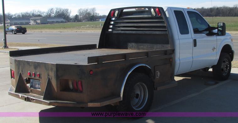 image for item J7688 2011 Ford F350 Super Duty SuperCab flatbed pickup truck