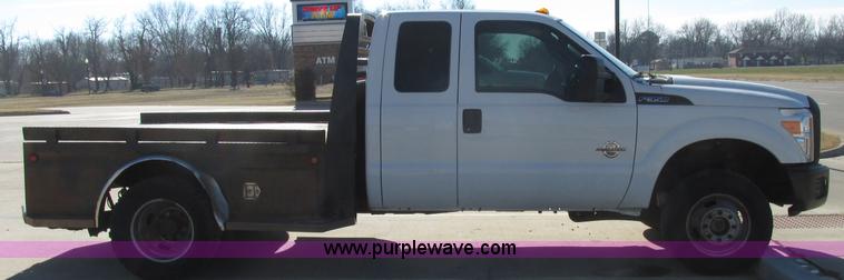 image for item J7688 2011 Ford F350 Super Duty SuperCab flatbed pickup truck