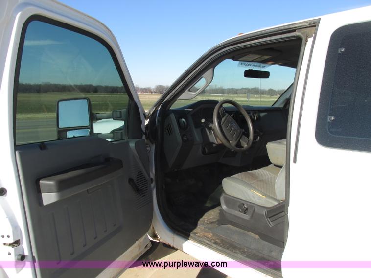 image for item J7688 2011 Ford F350 Super Duty SuperCab flatbed pickup truck