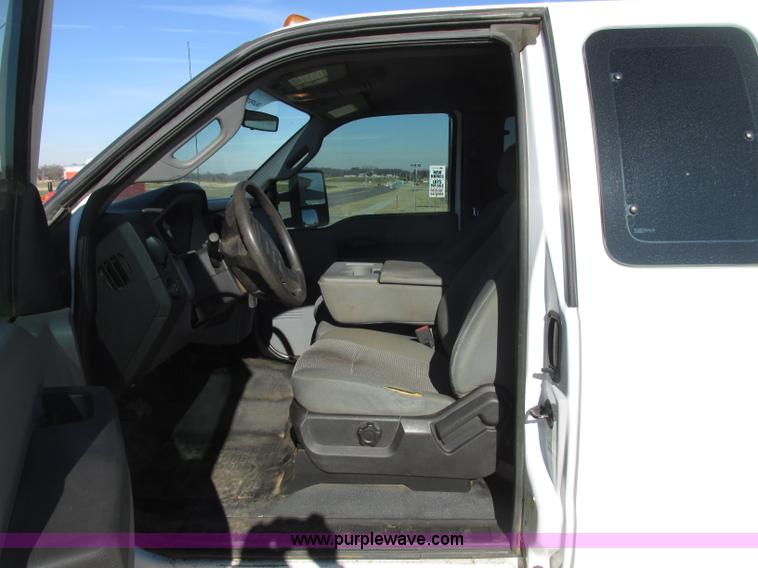 image for item J7688 2011 Ford F350 Super Duty SuperCab flatbed pickup truck