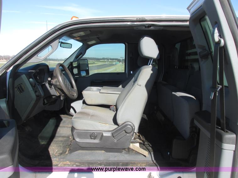 image for item J7688 2011 Ford F350 Super Duty SuperCab flatbed pickup truck