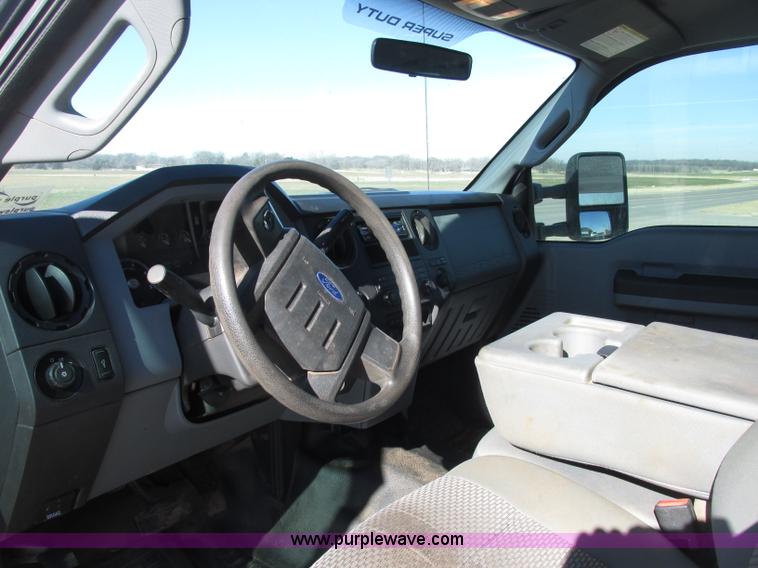 image for item J7688 2011 Ford F350 Super Duty SuperCab flatbed pickup truck