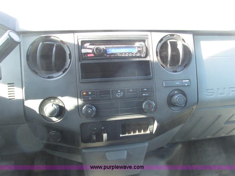 image for item J7688 2011 Ford F350 Super Duty SuperCab flatbed pickup truck