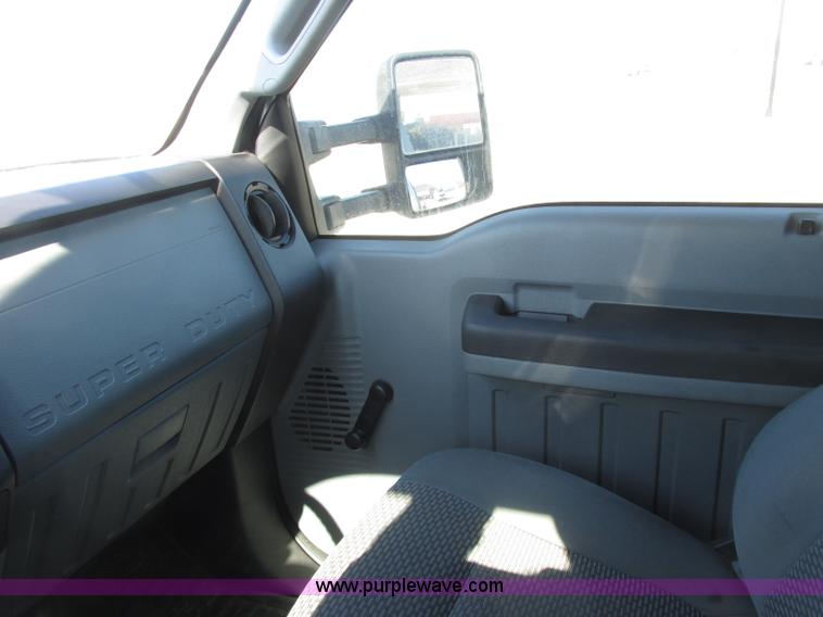 image for item J7688 2011 Ford F350 Super Duty SuperCab flatbed pickup truck