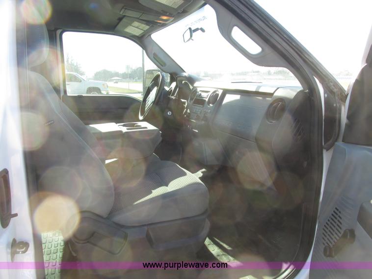 image for item J7688 2011 Ford F350 Super Duty SuperCab flatbed pickup truck