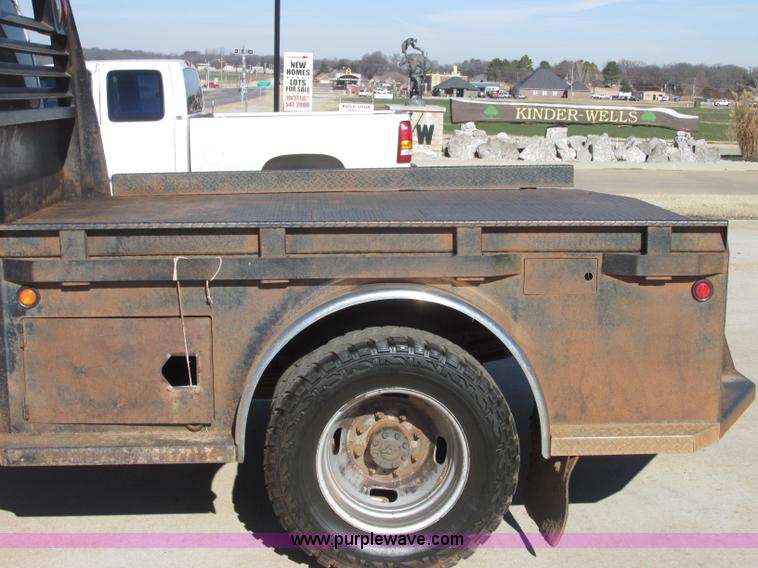 image for item J7688 2011 Ford F350 Super Duty SuperCab flatbed pickup truck