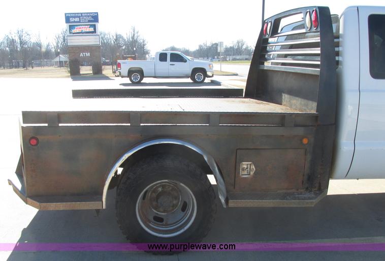image for item J7688 2011 Ford F350 Super Duty SuperCab flatbed pickup truck
