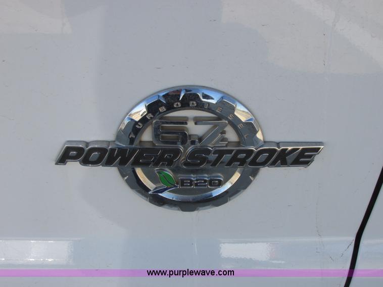 image for item J7688 2011 Ford F350 Super Duty SuperCab flatbed pickup truck