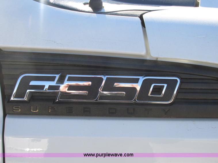 image for item J7688 2011 Ford F350 Super Duty SuperCab flatbed pickup truck