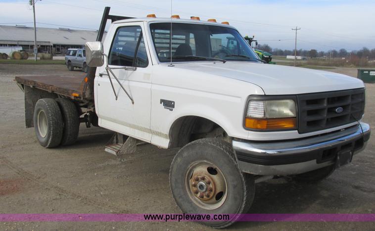 image for item L4229 1997 Ford F350 flatbed pickup truck