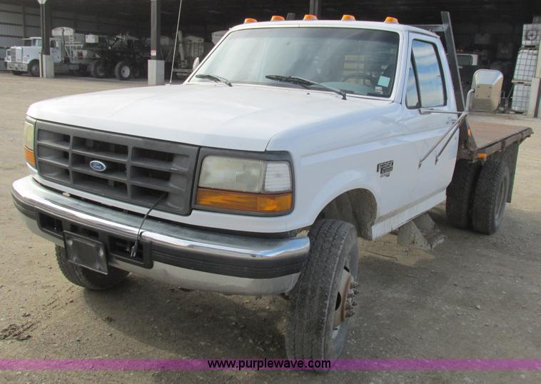 image for item L4229 1997 Ford F350 flatbed pickup truck