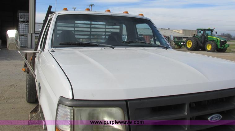 image for item L4229 1997 Ford F350 flatbed pickup truck