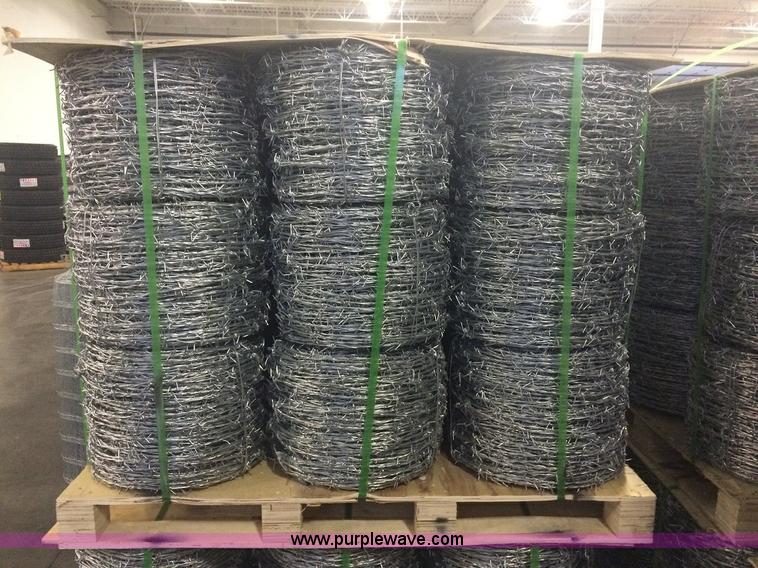 image for item F1001 (27) rolls of four point barbed wire