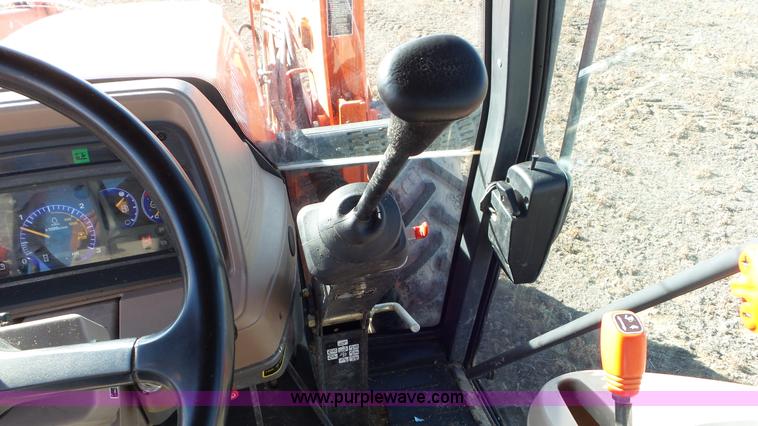 image for item G7104 Kubota M125X MFWD tractor